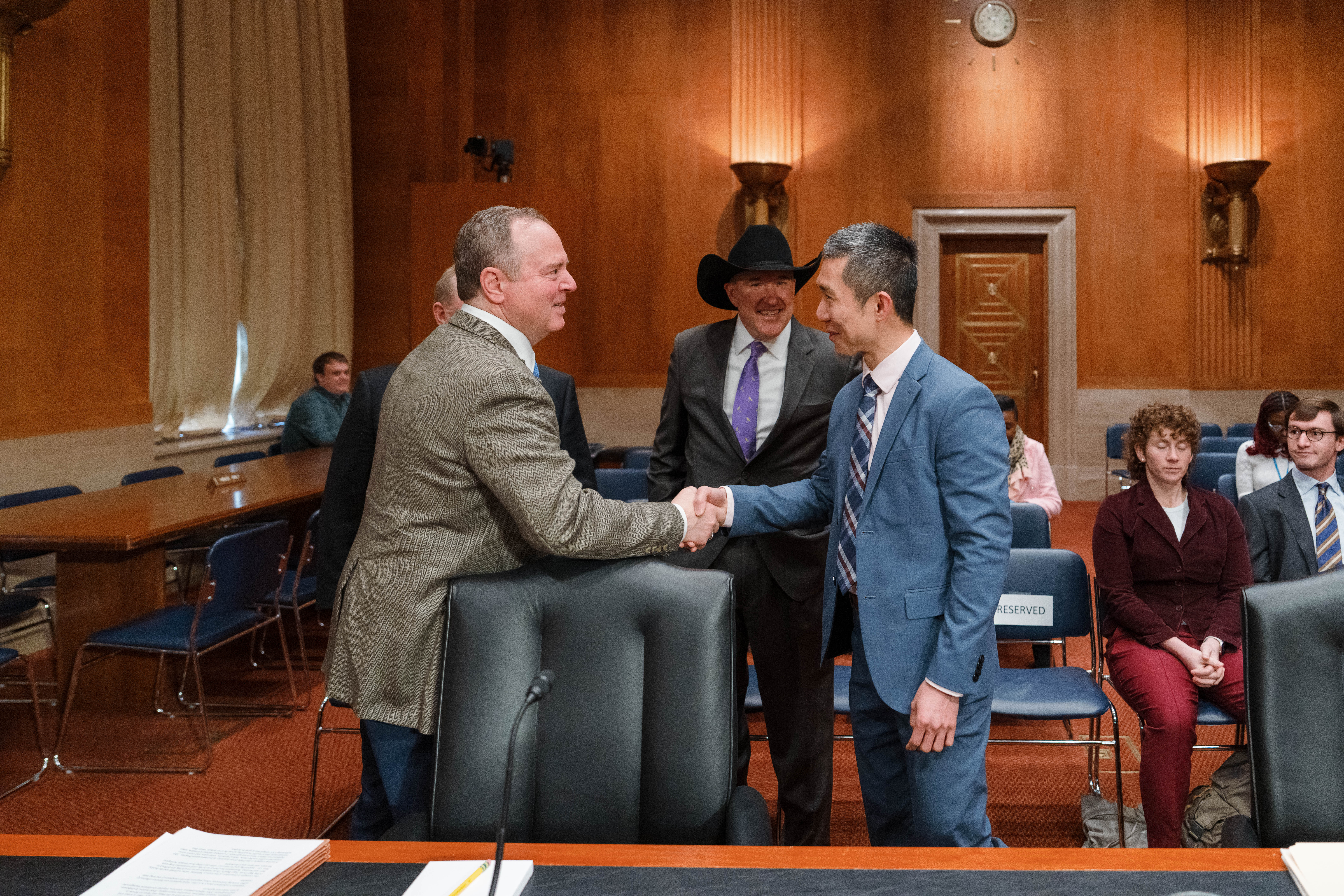 Two men shaking hands in the Senate